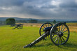 Morning storm clouds over a row of cannon Morning storm clouds over a row of cannon