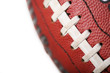 Close up view of part of a football showing the laces