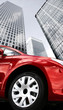 corporate red car wheel close up on a business environment