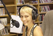 Young girl as announcer and dj at small broadcasting station