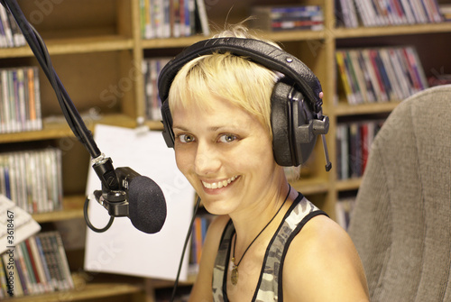 Photo: Young girl as announcer and dj at small broadcasting station Young girl as announcer and dj at small broadcasting station