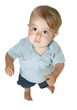 Baby boy stands and looks up