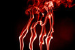 red blood smoke waves over black background