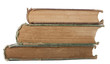 Pile of old books on white