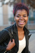 African American businesswoman at bus stop