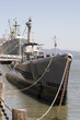 Submarine with war ship in the background