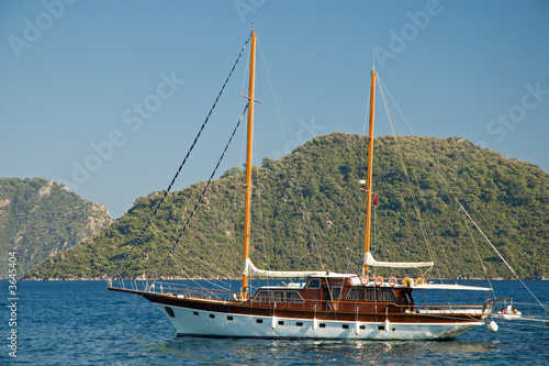 Beautiful Yacht against green mountain