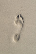 One Foot print on the sand.