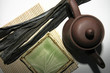 Splate with seaweed Kombu on bamboo mat, teapot