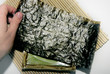 Making sushi: seaweed Nori, sushi plate and bamboo mat