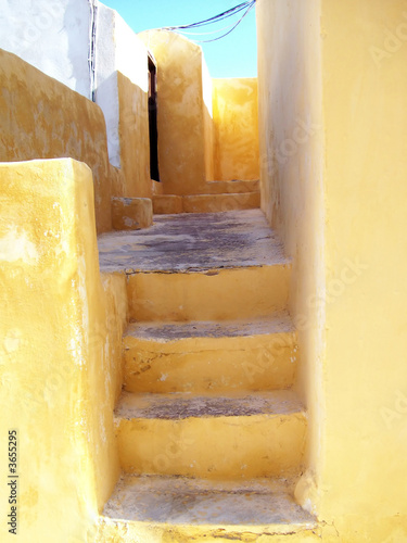 Lovely yellow steps found in Fira on Santorini in Greece