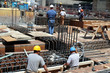 Construction workers, wearing hard hats