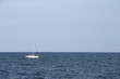 White sailboat without sails. Space for text