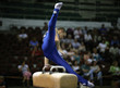 Photo: Young man competing on the pommel Young man competing on the pommel