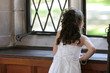 young child girl looking out window young child girl looking out window