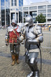 Two knights walking in a modern city Two knights walking in a modern city