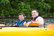 Father and son enjoying kayaking