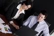 Business workgroup interacting in a boardroom setting 