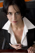 Attractive brunette business woman showing cleavage