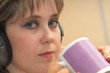 The girl drinks tea and listens to music hgfd1