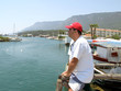 man sitting on pier