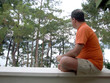 man listening to music on the porch