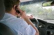 The man goes by the car and speaks by phone The man goes by the car and speaks by phone