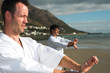 Young adult men with black belt practicing a Kata 