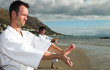 Young adult men with black belt practicing a Kata 