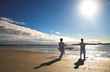 Photo: Young adult men with black belt practicing a Kata on the beach Young adult men with black belt practicing a Kata on the beach