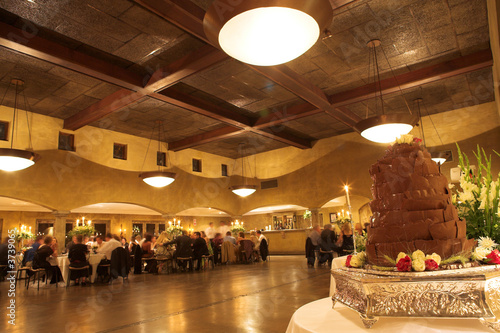 Photo: Layered chocolate wedding cake on a silver platter Layered chocolate wedding cake on a silver platter