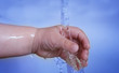 Life! Baby hand and running water Life! Baby hand and running water