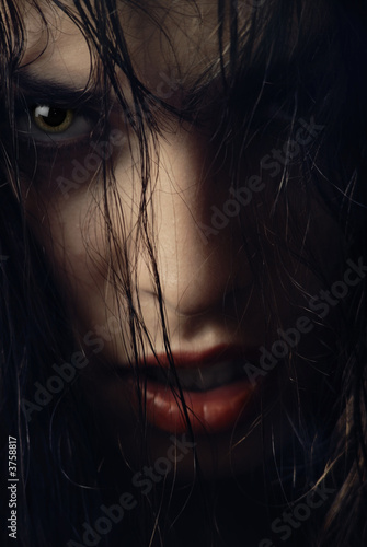 Photo: Close-up portrait of woman-witch with wet hairs Close-up portrait of woman-witch with wet hairs