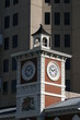 Photo: Clock tower in the city, contrast of old and new. Clock tower in the city, contrast of old and new.