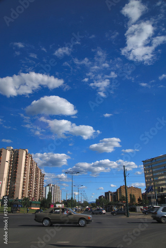 traffic in the city and blue sky with dramatic clouds