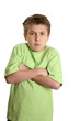 grumpy child with arms crossed and looking very stubborn