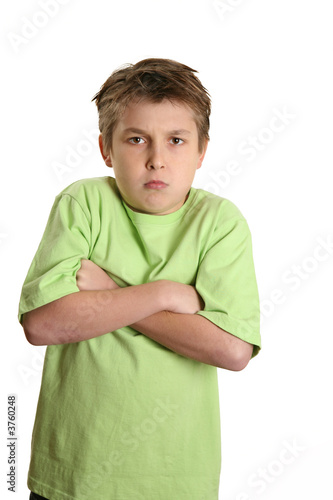 Photo: grumpy child with arms crossed and looking very stubborn grumpy child with arms crossed and looking very stubborn