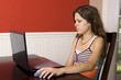 Young woman looking at her laptop.