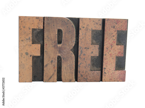 Photo: the word 'Free' in old, inkstained wood letterpress type the word 'Free' in old, inkstained wood letterpress type