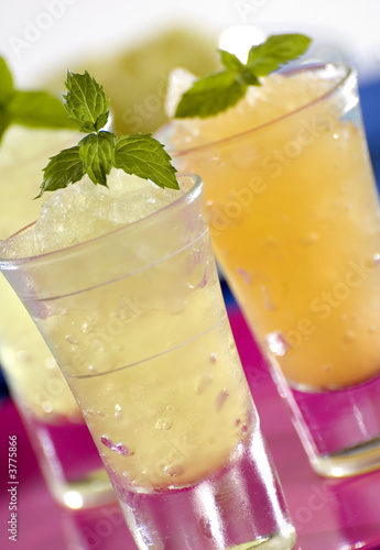 Photo: fresh lemon and orange granita close up fresh lemon and orange granita close up
