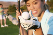 Photo: A pretty woman golfer holding a golf ball A pretty woman golfer holding a golf ball