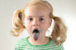 girl showing her tongue