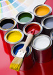 colorful cans and brush colorful cans and brush