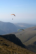 Paragliders over the mountains in Snowdonia Paragliders over the mountains in Snowdonia