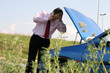 Businessman on a mobile phone in front of a broken car