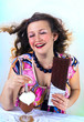 Laughing girl enjoying coffee drink and chocolate