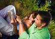 couple reading a book outdoor at sunset