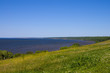 Sunny coast of a bay of the river Volga