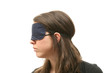 Woman wearing a blindfold isolated over white