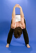 A woman praticing yoga in a posture 